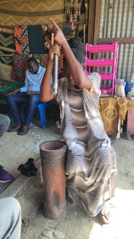 Dinka woman pounding ginger - image by Kenyatta University / SPARC