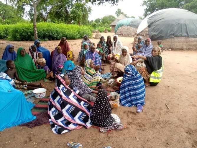 Women and girls in a focus group discussion with FUDECO