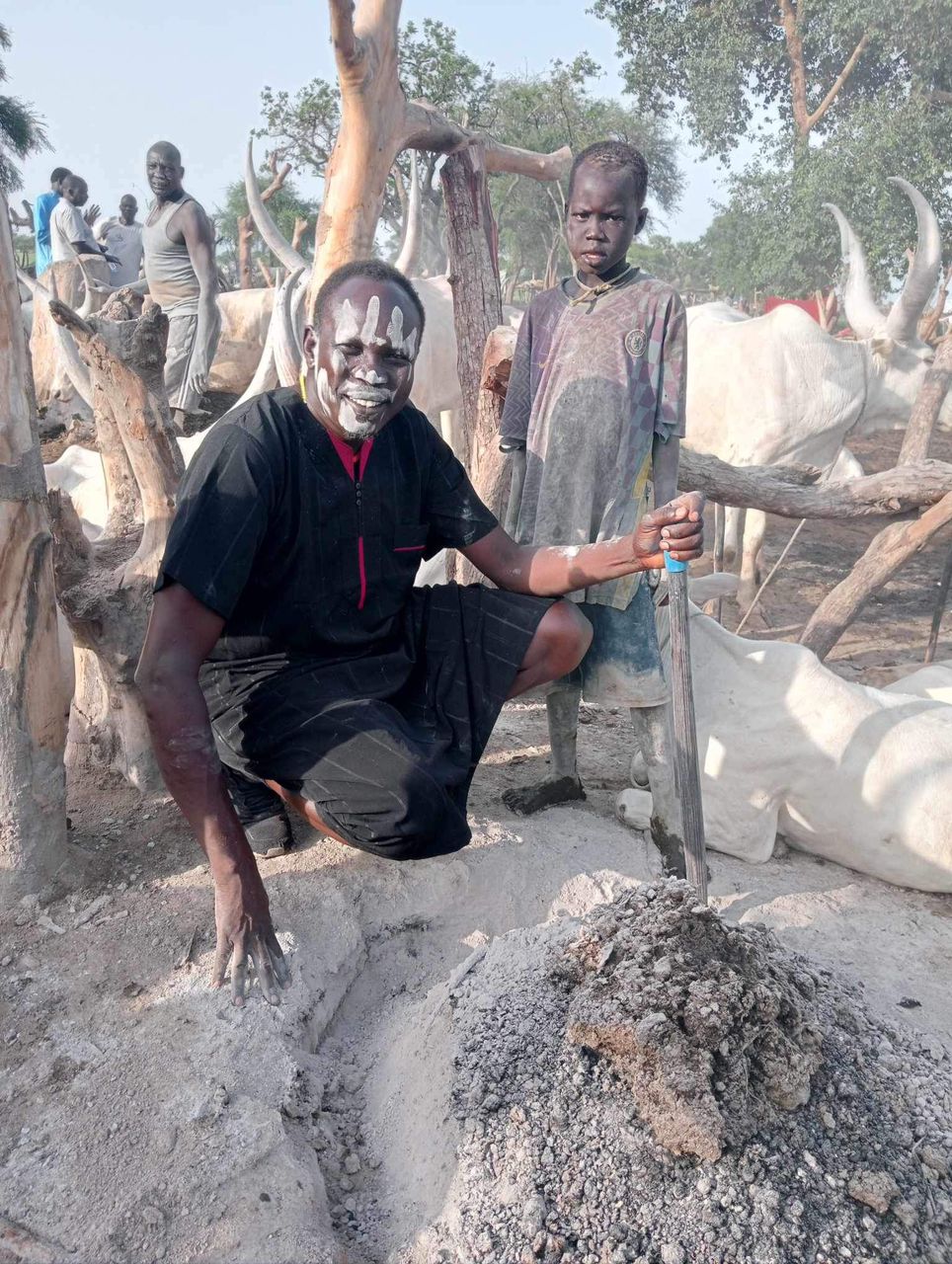 A Dinka herder demonstrates one way that soot is used - Image by Kuch Maluk / Kenyatta University