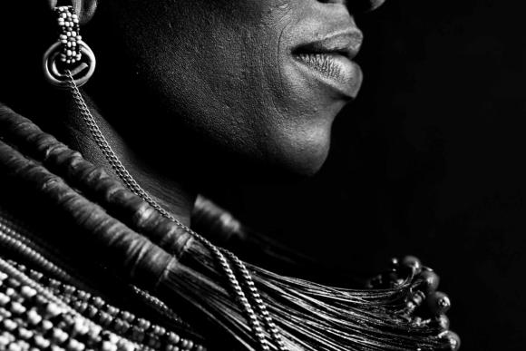Close up profile of a young woman in traditional samburu dress 