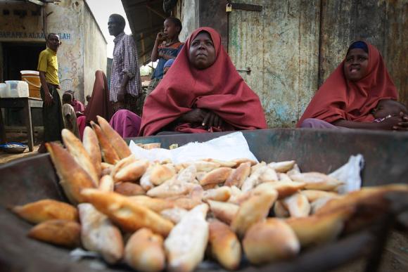 A Somali woman sells bread in a market in Jowhar, Middle Shabelle region - Image by AU-UN IST / Stuart Price - public domain