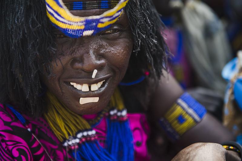 A woman faces the camera smiling