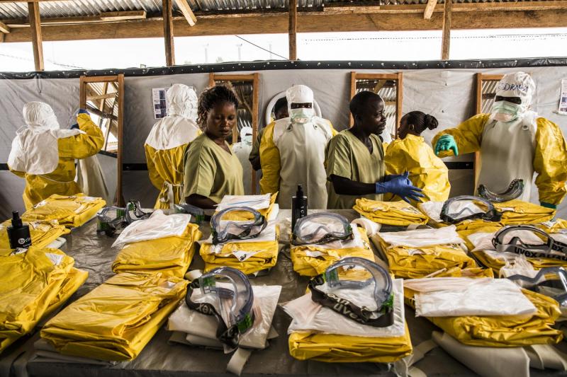 Health workers in the Democratic Republic of the Congo wear protective equipment before treating people suspected of having Ebola.