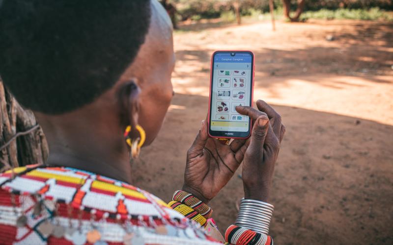 A Samburu woman from Northern Kenya enters data into the Mbiotisho app. Credit: ILRI