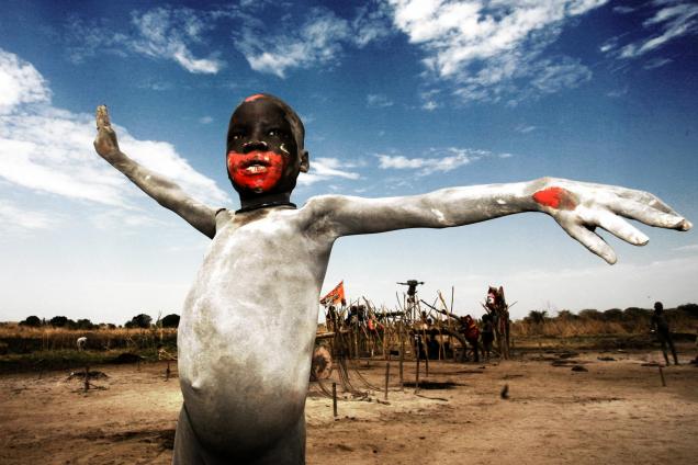 Ash-dressed Mundari child celebrating the first South Sudan Independence Day in Mungalla, South Sudan