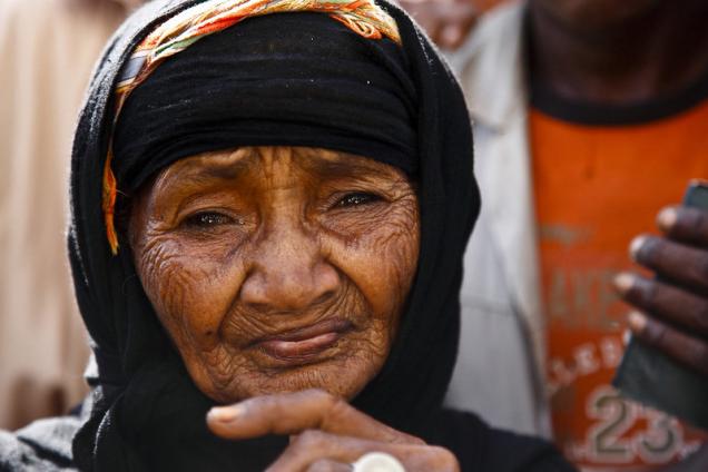 Elderly woman at at Mazrak camp, north west Yemen. She has fled conflict in her home village Harad, on the border with Saudi Arabia.