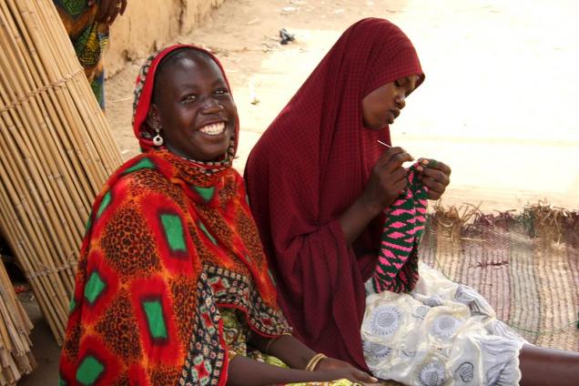 Two friends sit in the shade in Linia, Chari-Baguirmi, Chad.