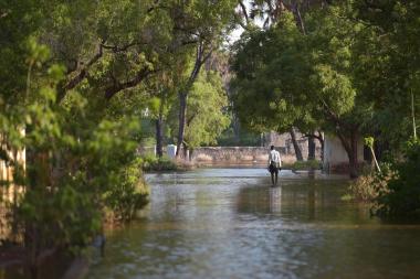 A man walks through the flood waters in Beletweyne, Somalia in May 2016. 