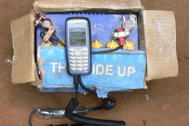 A mobile phone is charged using a car battery in Kiwanji, Uganda - Image by Ken Banks - CC BY 2.0