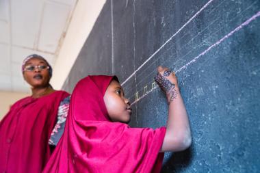 A student at a blackboard in a class in Niamey, Niger.