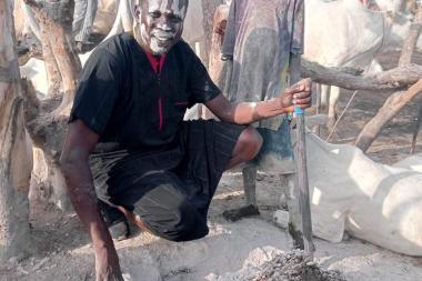 Dinka herder demonstrating other uses of soot from the fire in Jonglei, South Sudan - Image by Kuch Maluk