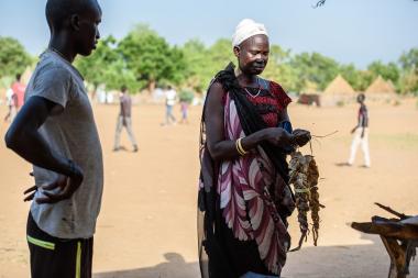 Woman buying preserved fish in Nyal, South Sudan 2017. Credit: Huxta Mercy Corps