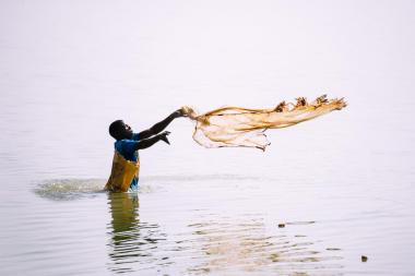 A fisherman casts his net on Lake Bam, Burkina Faso.