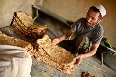 A local breadmaker prepares stacks of bread in Helmand Province, Afghanistan - image by Resolute Support Media - CC-BY-2.0-DEED