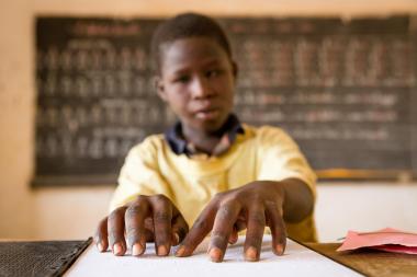 Abdul Aziz Mounkeila learns to read Braille at a school in Niger.